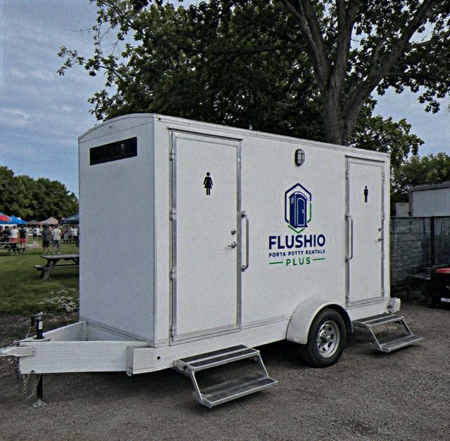 Two-stall towable restroom trailer rental with step entry and handrails